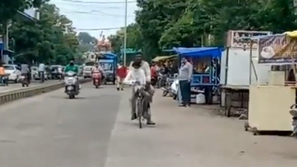 కొడుకు పరీక్ష రాయించడానికి 105 కి.మీ సైకిల్ పై తీసుకెళ్లిన తండ్రి