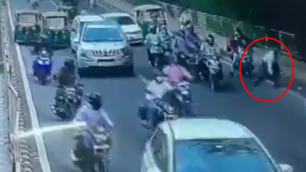 కారు బోనెట్ మీద పడిన పోలీస్.. పట్టించుకోకుండా కార్ డ్రైవింగ్, చివరికి ఏమైందంటే ?