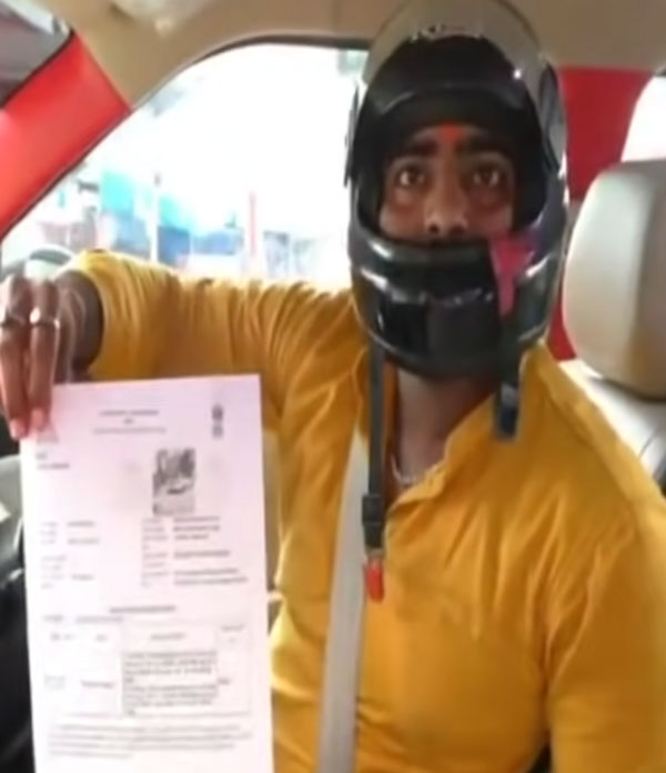 హెల్మెట్ లేదని కారు డ్రైవర్కు జరిమానా.. ఎక్కడో తెలుసా?